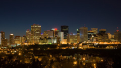 The skyline of Edmonton, Alberta at night, lit by city lights.