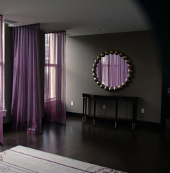 A mirror reflects light which can brighten a darker room